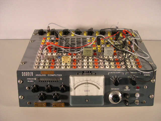  image of Front and top view of the Donner 3500 analog computer.  The wires (called patchcords) were used to program the computer; imagine substituting that wiring process for the modern keyboard. 