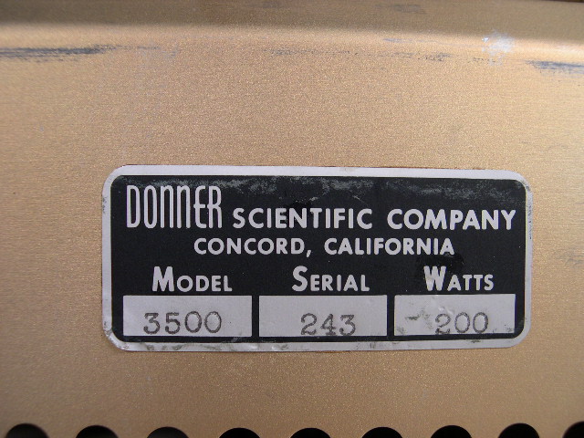Closeup of the manufacturer's tag that includes the serial number.  You can also clearly see the company's name.  Later versions of this classic analog computer display the name Systron-Donner after the companies merged in 1960.